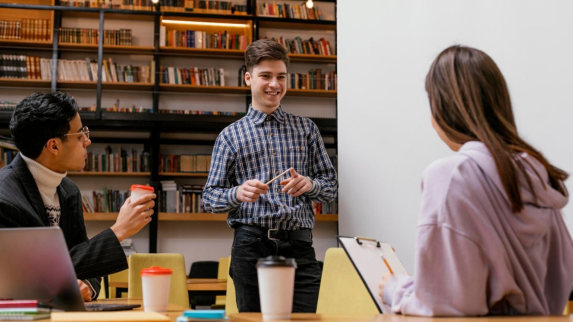 Student reviewing monthly budget spreadsheet on laptop